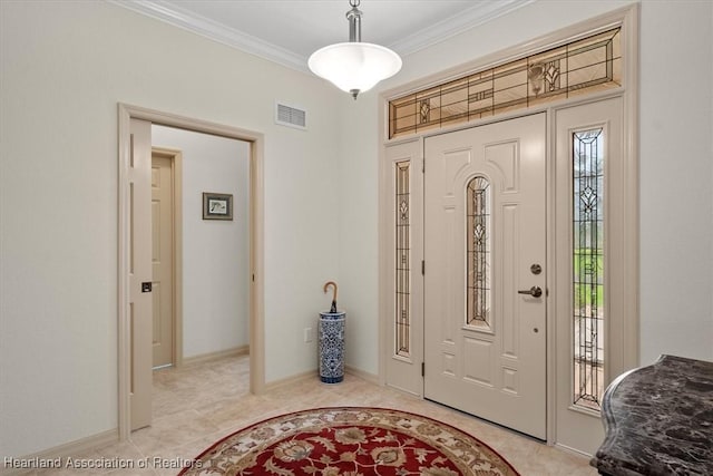 foyer featuring crown molding and light tile patterned floors