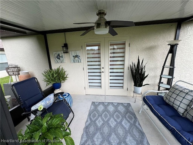 view of patio with ceiling fan and french doors