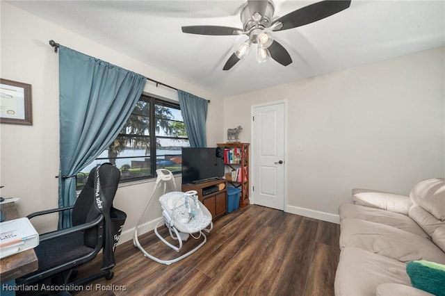 home office featuring dark wood-style floors, baseboards, and a ceiling fan