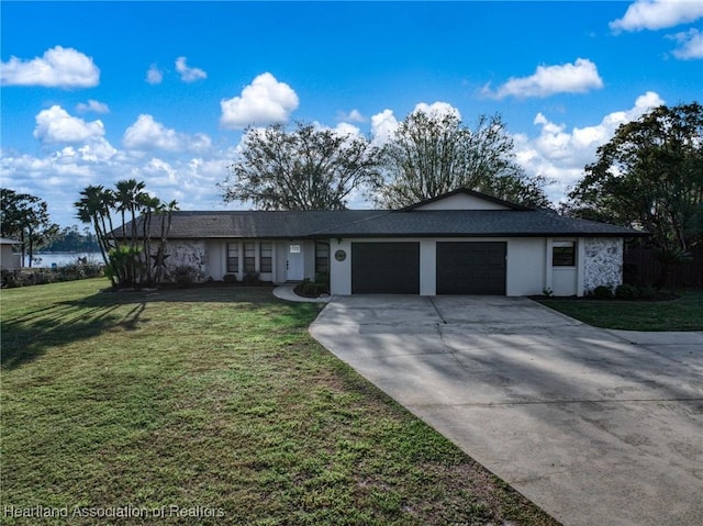 single story home featuring concrete driveway, a front lawn, an attached garage, and stucco siding