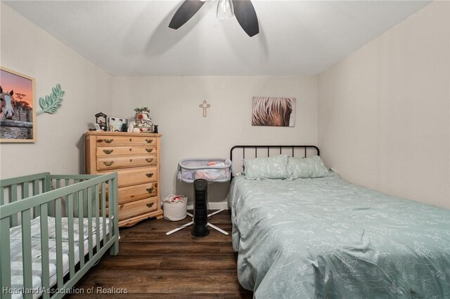 bedroom with dark wood-style floors and ceiling fan