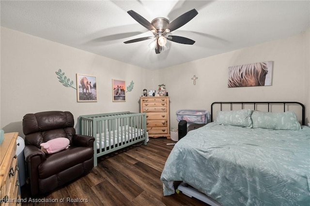 bedroom featuring ceiling fan and wood finished floors