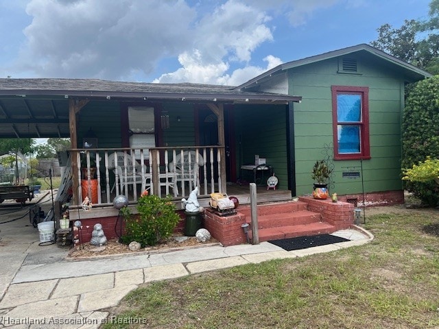 410 Walnut St, Sebring, FL 33870 - back of property with covered porch