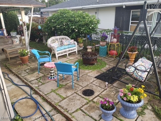 410 Walnut St, Sebring, FL 33870 - view of patio featuring an outdoor fire pit and a gazebo