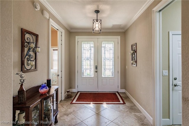 tiled foyer featuring french doors and ornamental molding