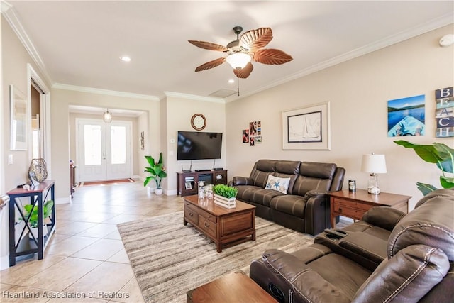 living room with ornamental molding, light tile patterned flooring, ceiling fan, and french doors