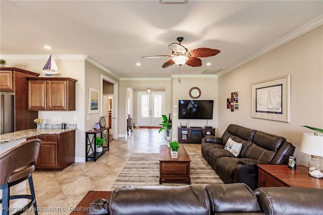 living room with crown molding, ceiling fan, and light tile patterned floors