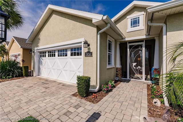 entrance to property featuring a garage