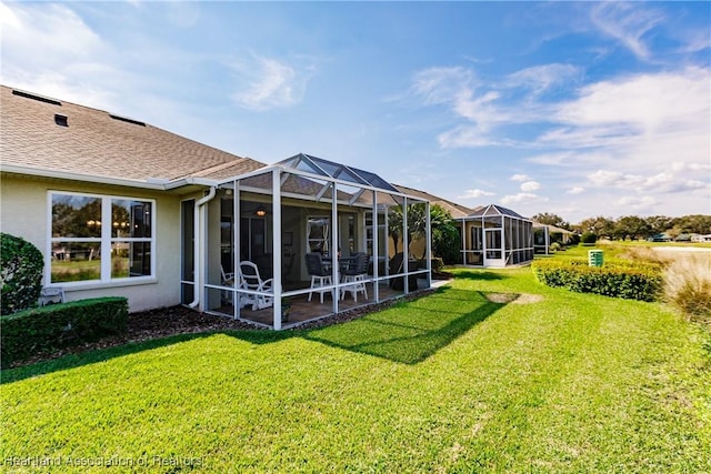 view of yard featuring glass enclosure