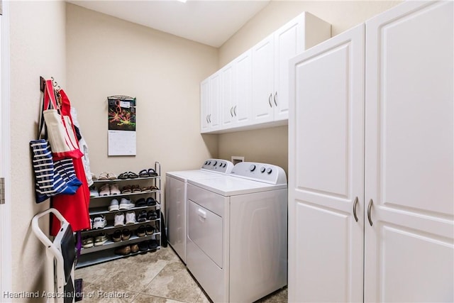 laundry area featuring cabinets and washer and dryer