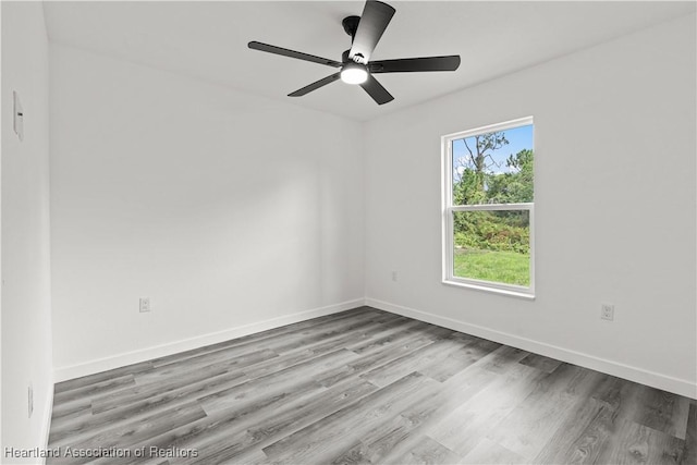 1502 Oak Ave, Lake Placid, FL 33852 - empty room with wood finished floors and baseboards