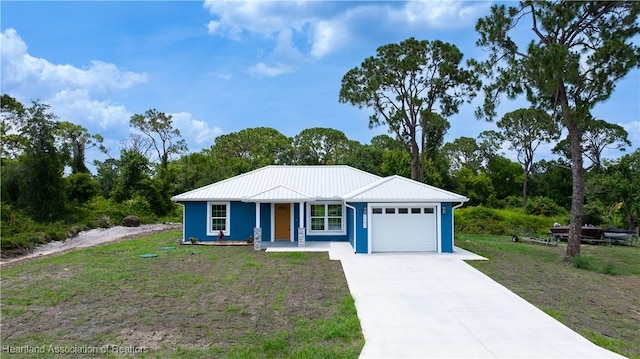 1502 Oak Ave, Lake Placid, FL 33852 - single story home with a garage, concrete driveway, a front lawn, and metal roof