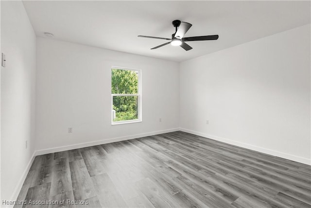 1502 Oak Ave, Lake Placid, FL 33852 - spare room featuring a ceiling fan, wood finished floors, baseboards, and a smoke detector