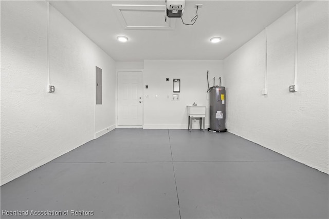 1502 Oak Ave, Lake Placid, FL 33852 - garage with water heater, electric panel, and a garage door opener