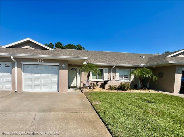 ranch-style house featuring stucco siding, a shingled roof, an attached garage, driveway, and a front lawn