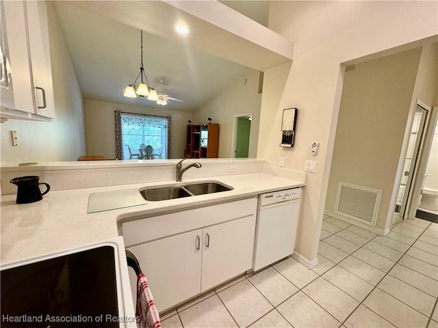 kitchen featuring dishwasher, light countertops, visible vents, and a sink