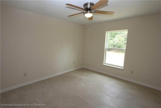 spare room with ceiling fan