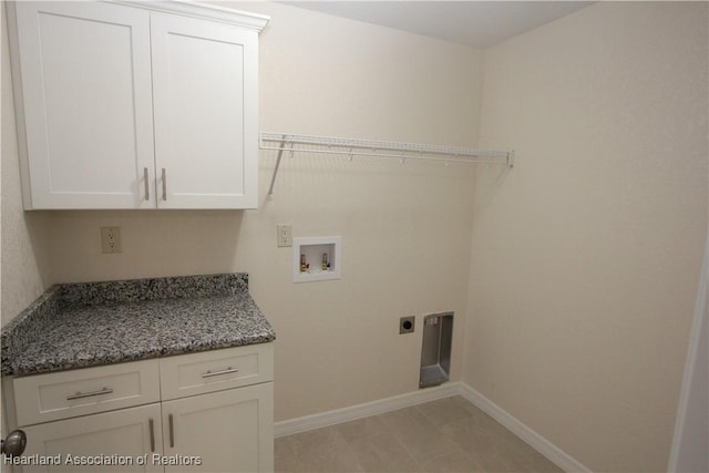 laundry room with cabinets, washer hookup, and electric dryer hookup