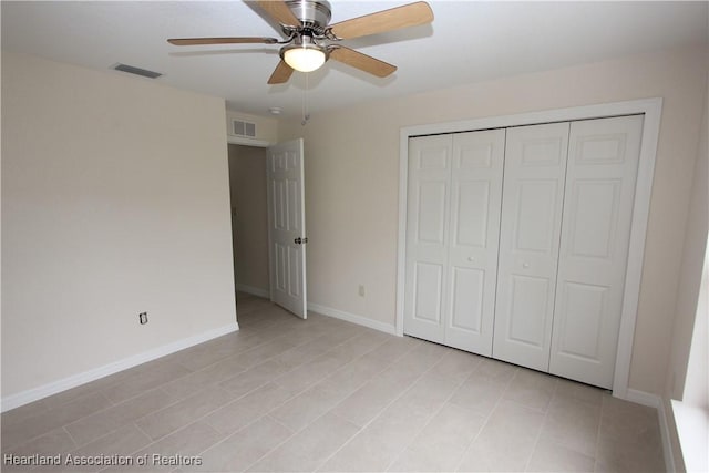 unfurnished bedroom with a closet and ceiling fan