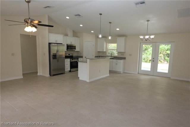 kitchen featuring white cabinetry, a center island, decorative light fixtures, and appliances with stainless steel finishes