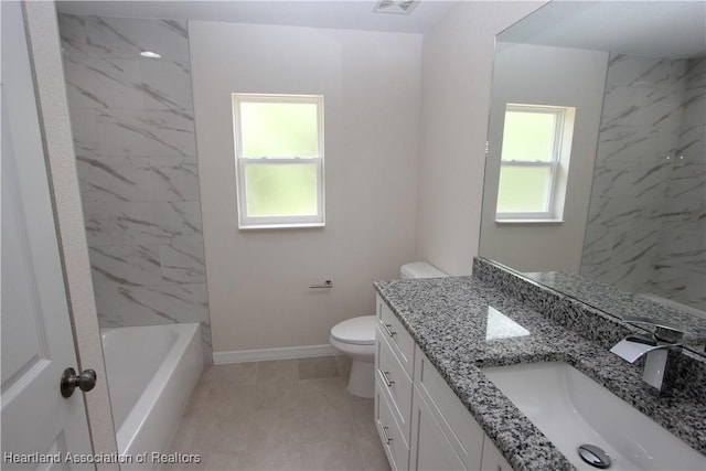 bathroom with tile patterned floors, vanity, and toilet