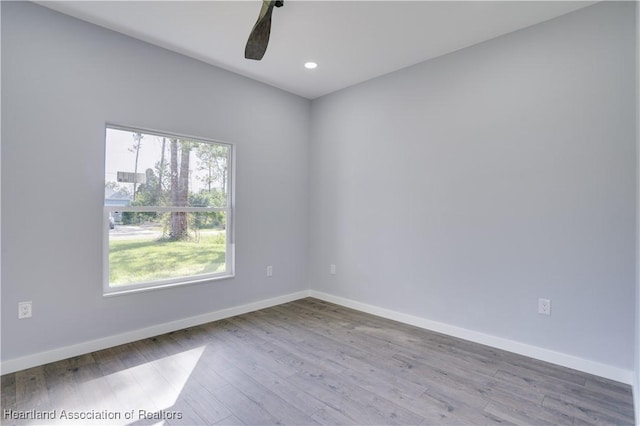 unfurnished room with ceiling fan and light hardwood / wood-style flooring