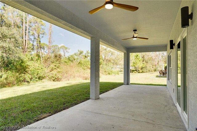 view of patio featuring ceiling fan