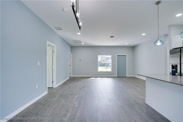 unfurnished living room featuring light hardwood / wood-style flooring