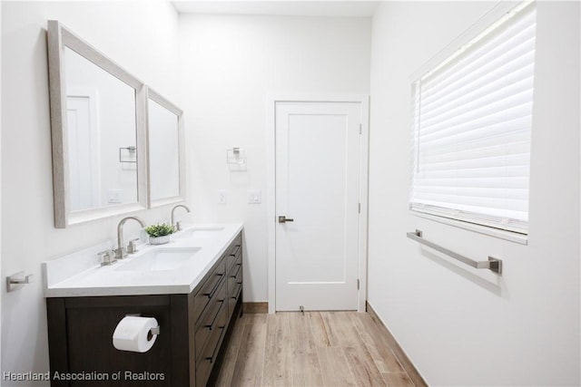 bathroom featuring vanity and hardwood / wood-style flooring