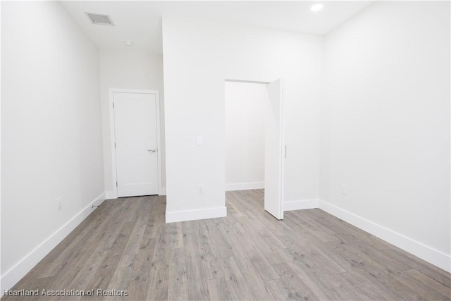 spare room featuring light wood-type flooring