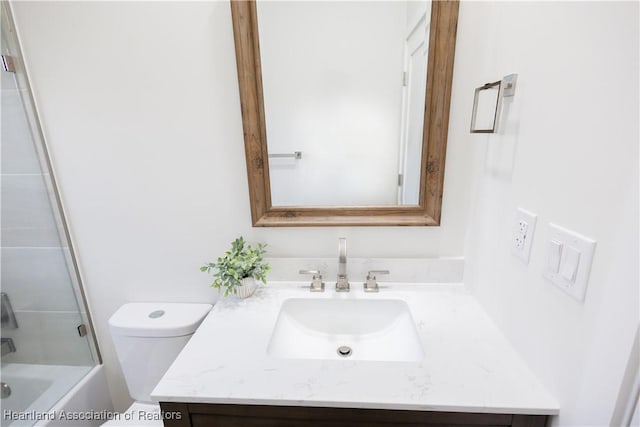 full bathroom featuring toilet, shower / bathing tub combination, and vanity