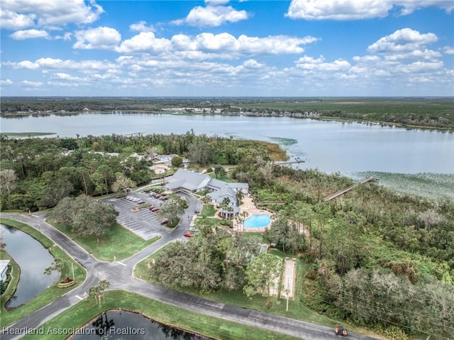 birds eye view of property with a water view