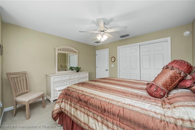 bedroom with ceiling fan and light colored carpet