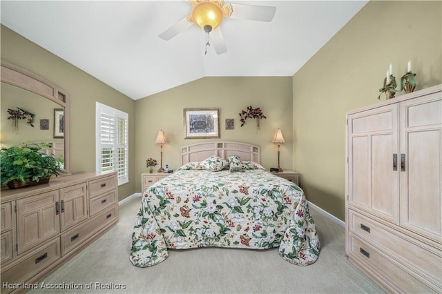 carpeted bedroom featuring ceiling fan and lofted ceiling