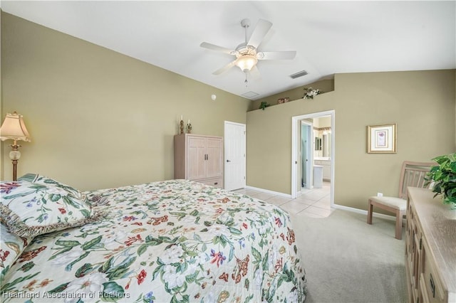 carpeted bedroom featuring ensuite bath, ceiling fan, and lofted ceiling