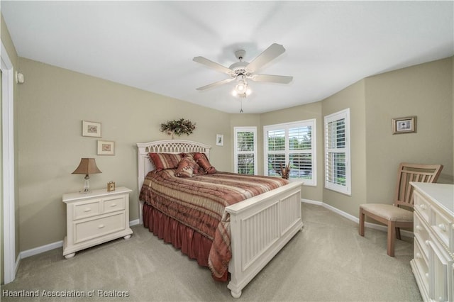 bedroom featuring ceiling fan and light colored carpet