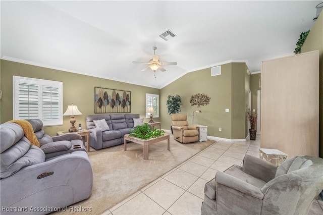 tiled living room with vaulted ceiling, ceiling fan, and ornamental molding