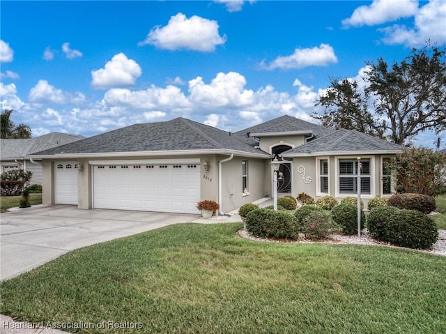 view of front of home featuring a garage and a front yard