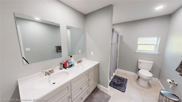 bathroom with vanity, toilet, walk in shower, and tile patterned flooring