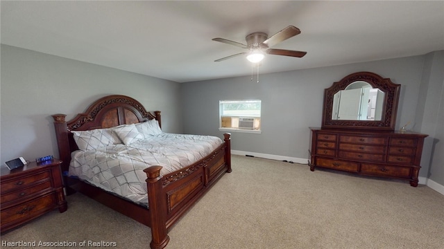 carpeted bedroom featuring ceiling fan and cooling unit