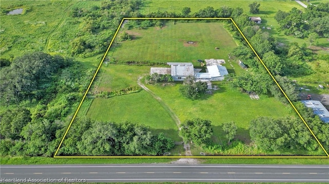 birds eye view of property featuring a rural view