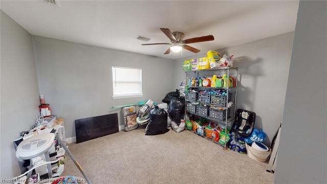 recreation room featuring ceiling fan and carpet