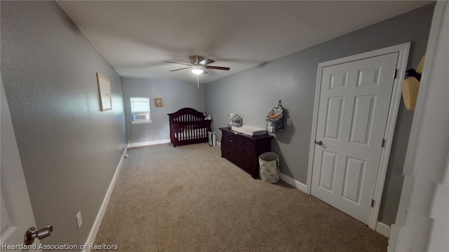 carpeted bedroom featuring ceiling fan