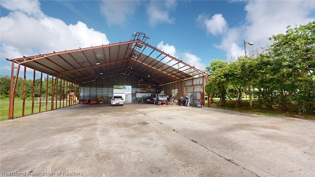 view of vehicle parking featuring a carport