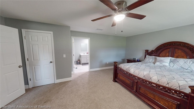 bedroom featuring ceiling fan and ensuite bath