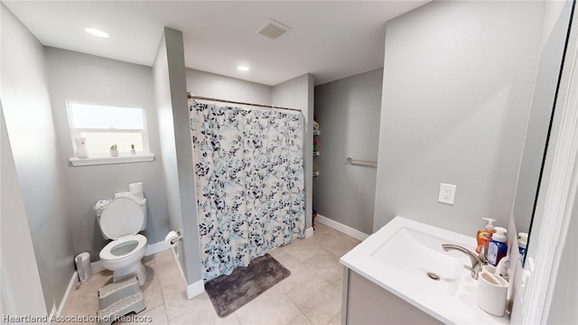 bathroom featuring tile patterned floors, toilet, vanity, and a shower with curtain