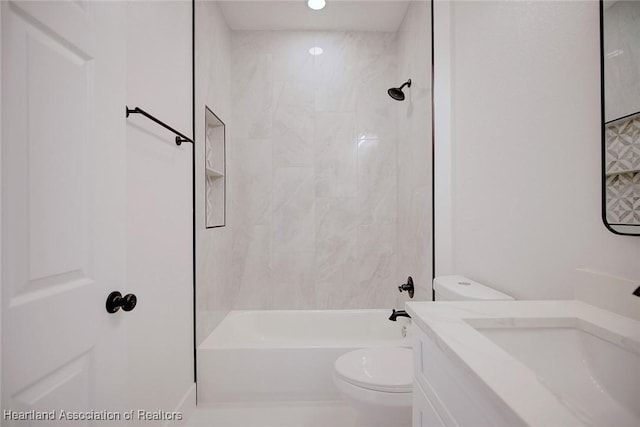 full bathroom featuring toilet, tub / shower combination, and vanity