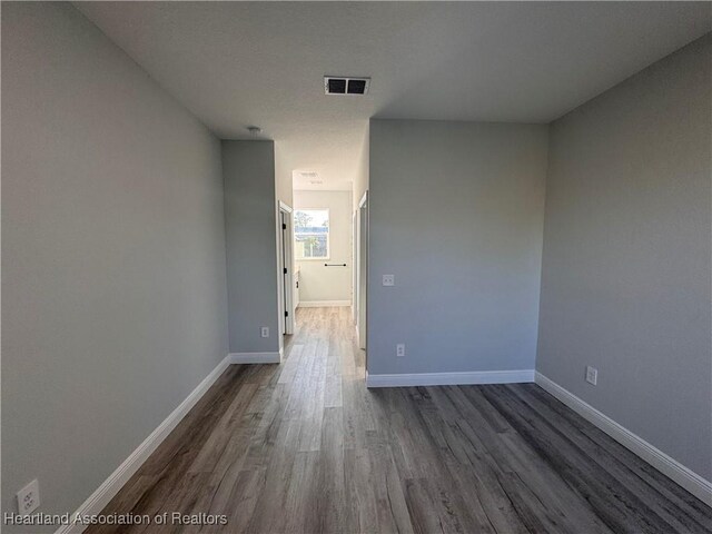 1940 Alan St, Sebring, FL 33875 - spare room with dark wood-type flooring