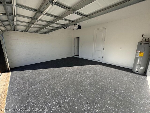 1940 Alan St, Sebring, FL 33875 - garage with a garage door opener and water heater