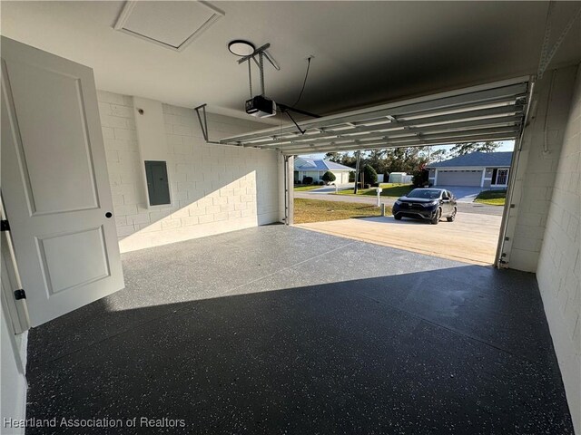 1940 Alan St, Sebring, FL 33875 - garage with electric panel and a garage door opener